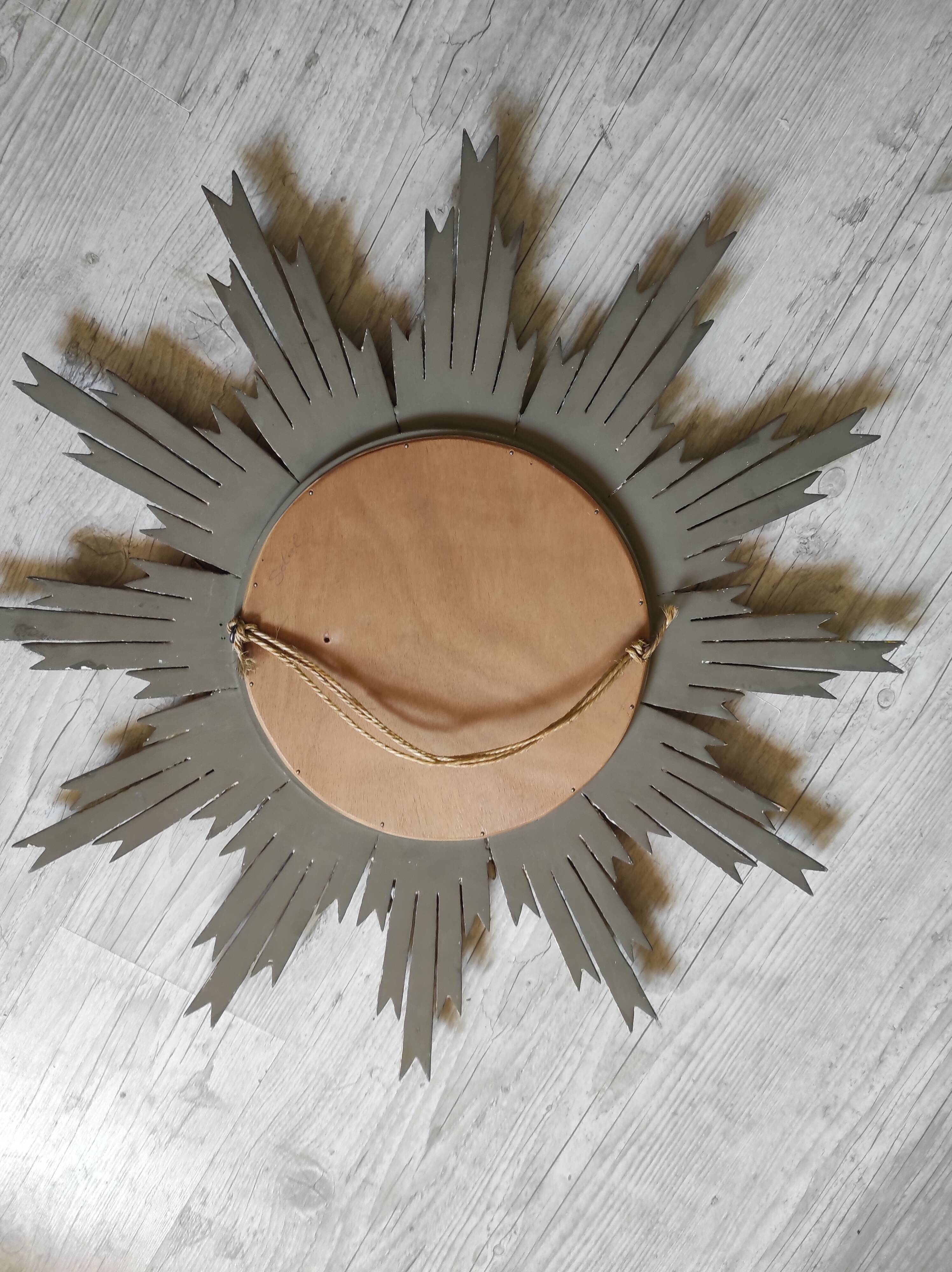 Sun mirror and witch's eye in gilded wood