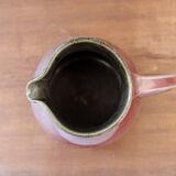 Signed enamelled ceramic pitcher