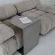 C-shaped brushed stainless steel side table
