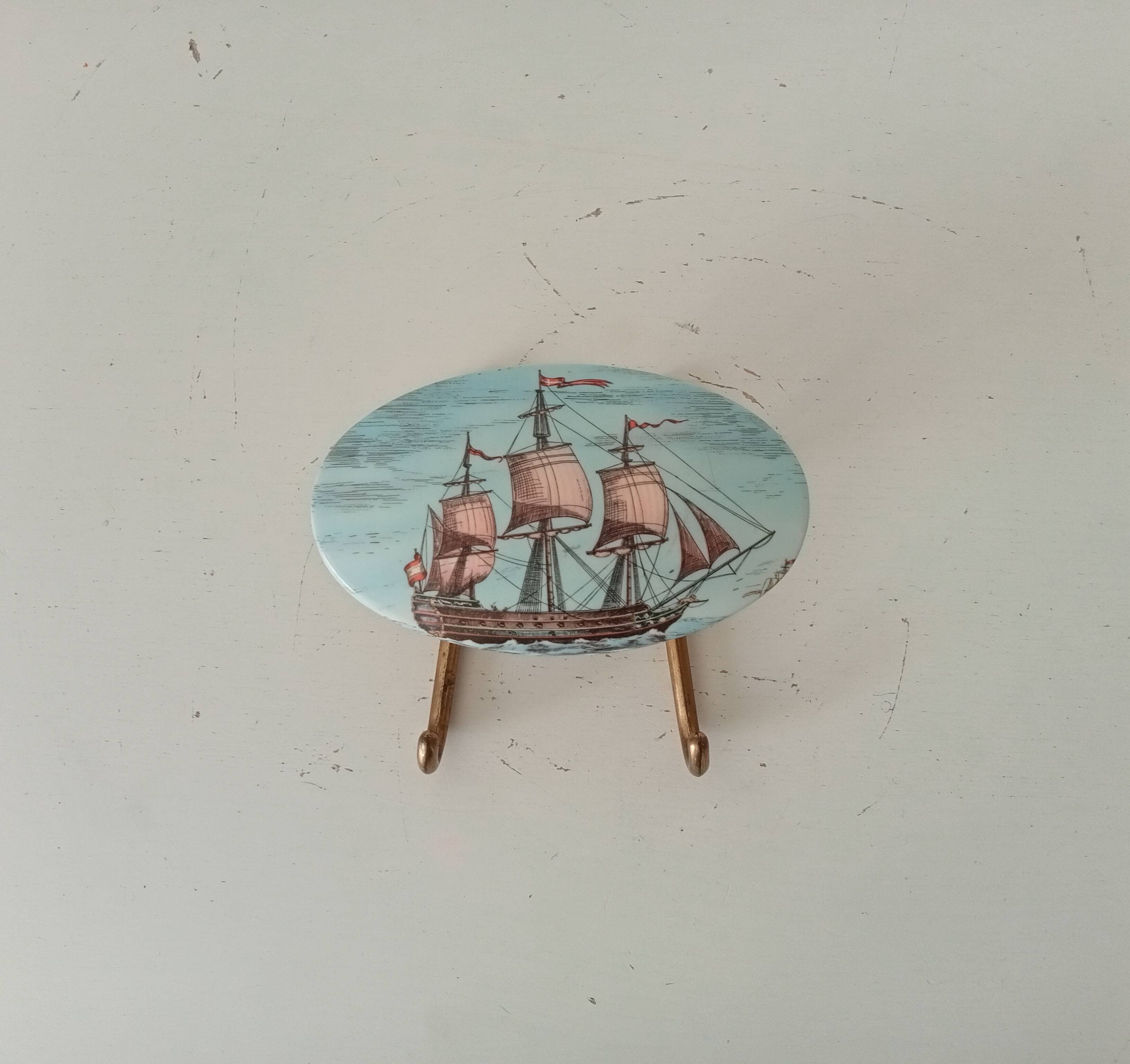 Vintage wall coat hook in brass and Bakelite.