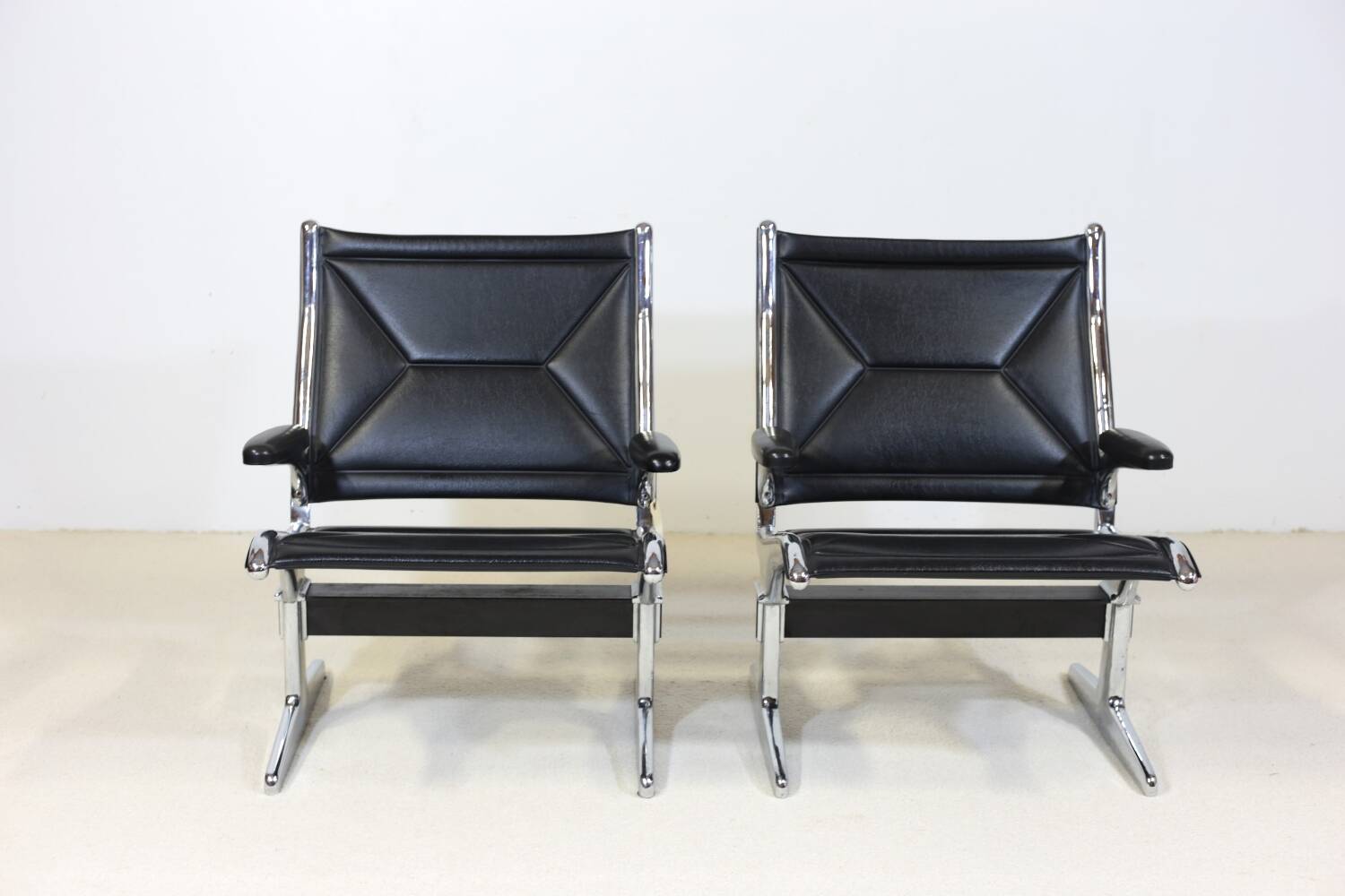Pair of Eames Sling Tandem armchairs