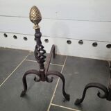 Old pair of wrought iron pegs with brass pine cone