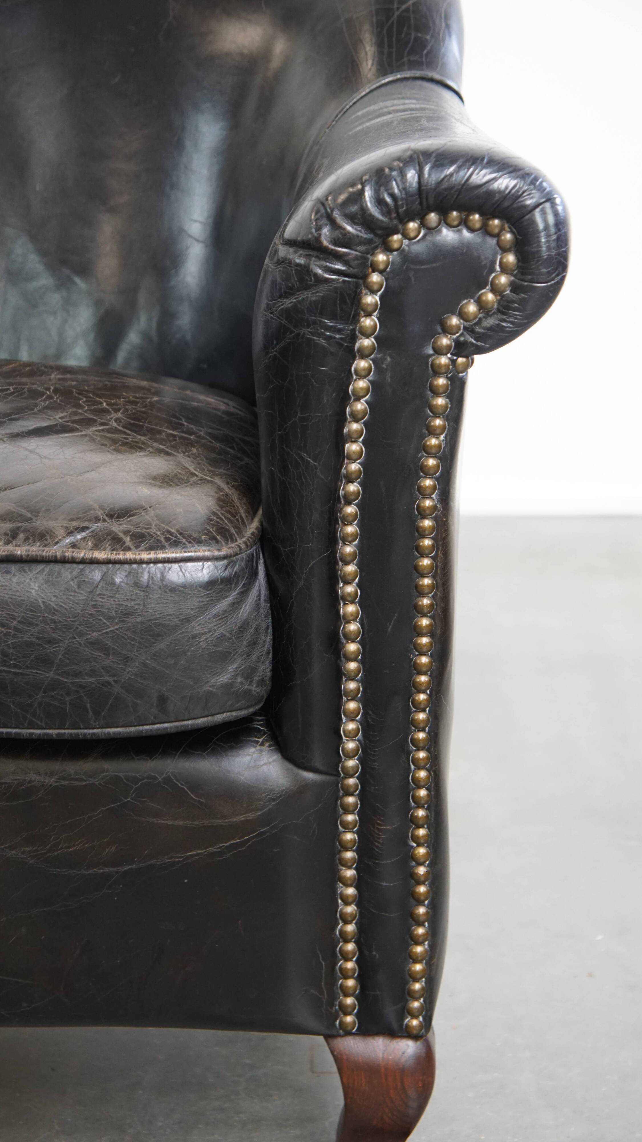 Black cowhide leather armchair