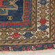 Handwoven blue ground persian rug with bird-like figures