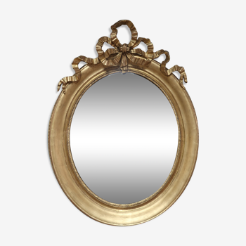 Oval mirror in gilded wood 93x73cm