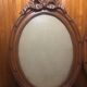 Old carved wooden medallion frame