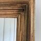Antique giltwood wall mirror in gold