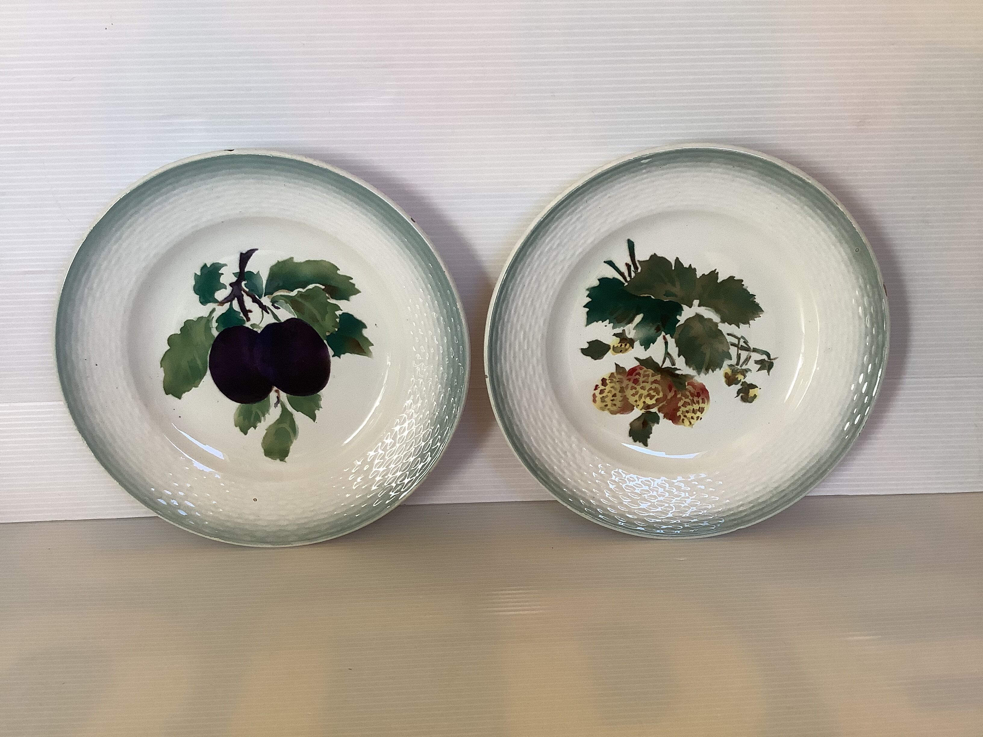 Pair of antique Saint Amand fruit plates.