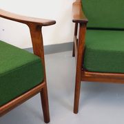 Pair of vintage Scandinavian armchairs in teak and green fabric from the 1960s.