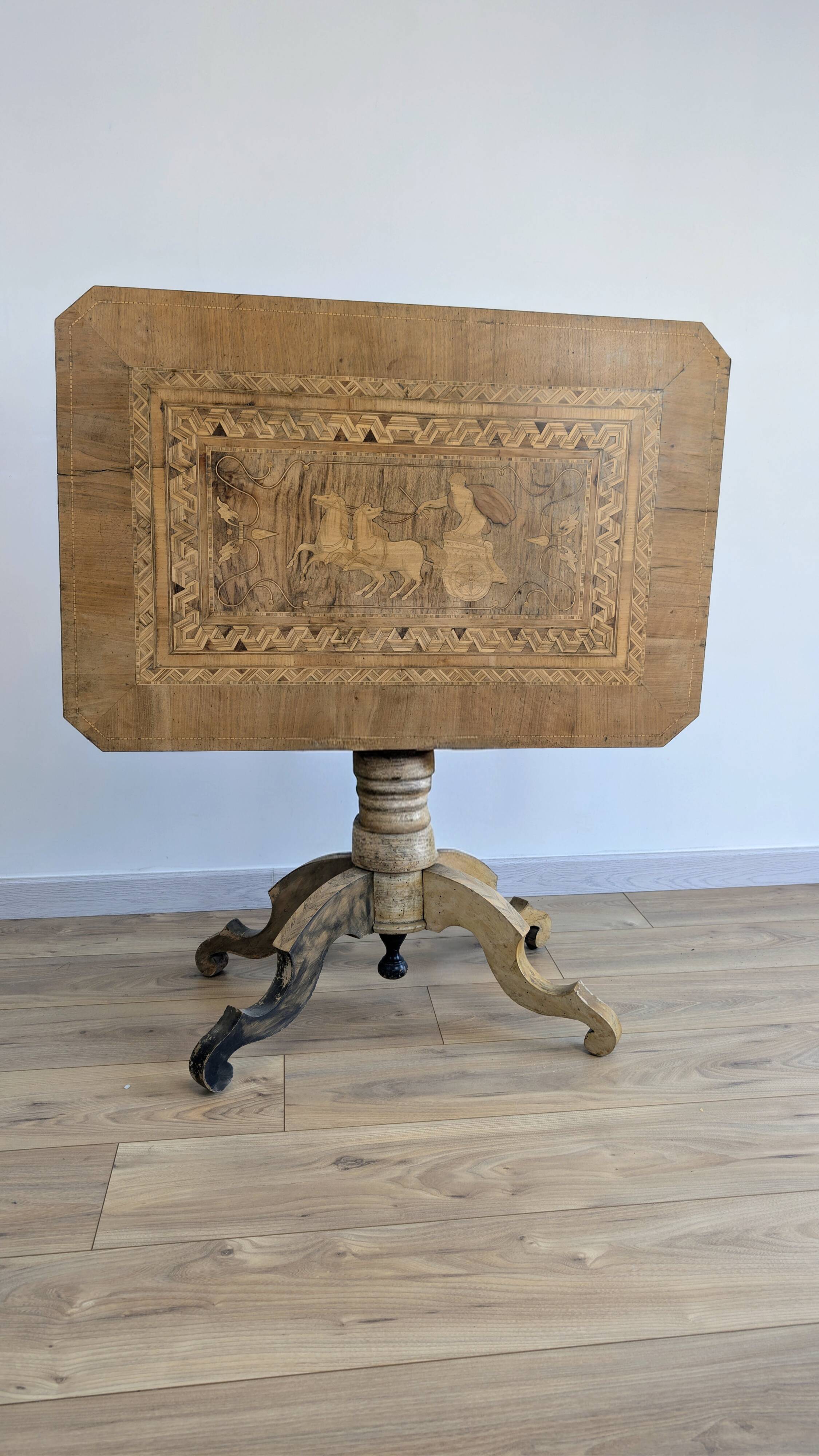 Italian folding gueridon with marquetry of an antique scene, 19th century.