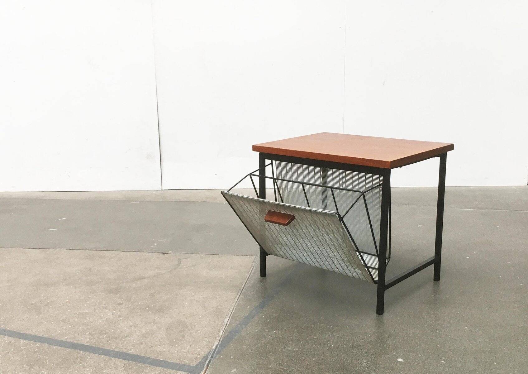 Mid-century teak side table with magazine rack.