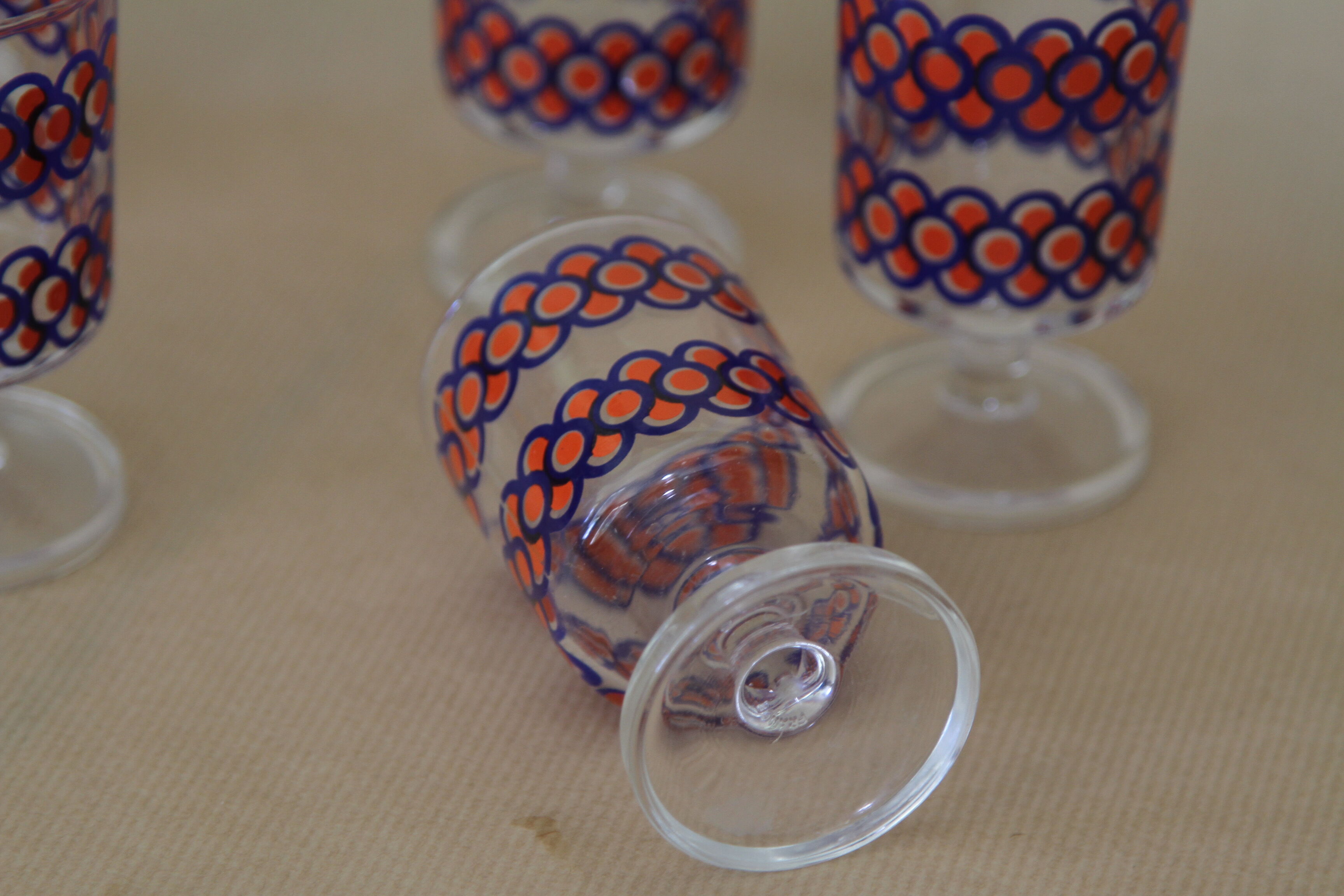 Blue and orange patterned foot glasses set