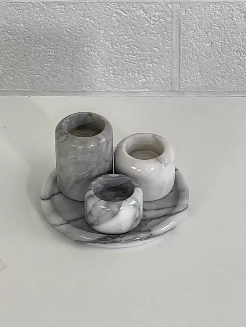 Set of marble candle holders with base