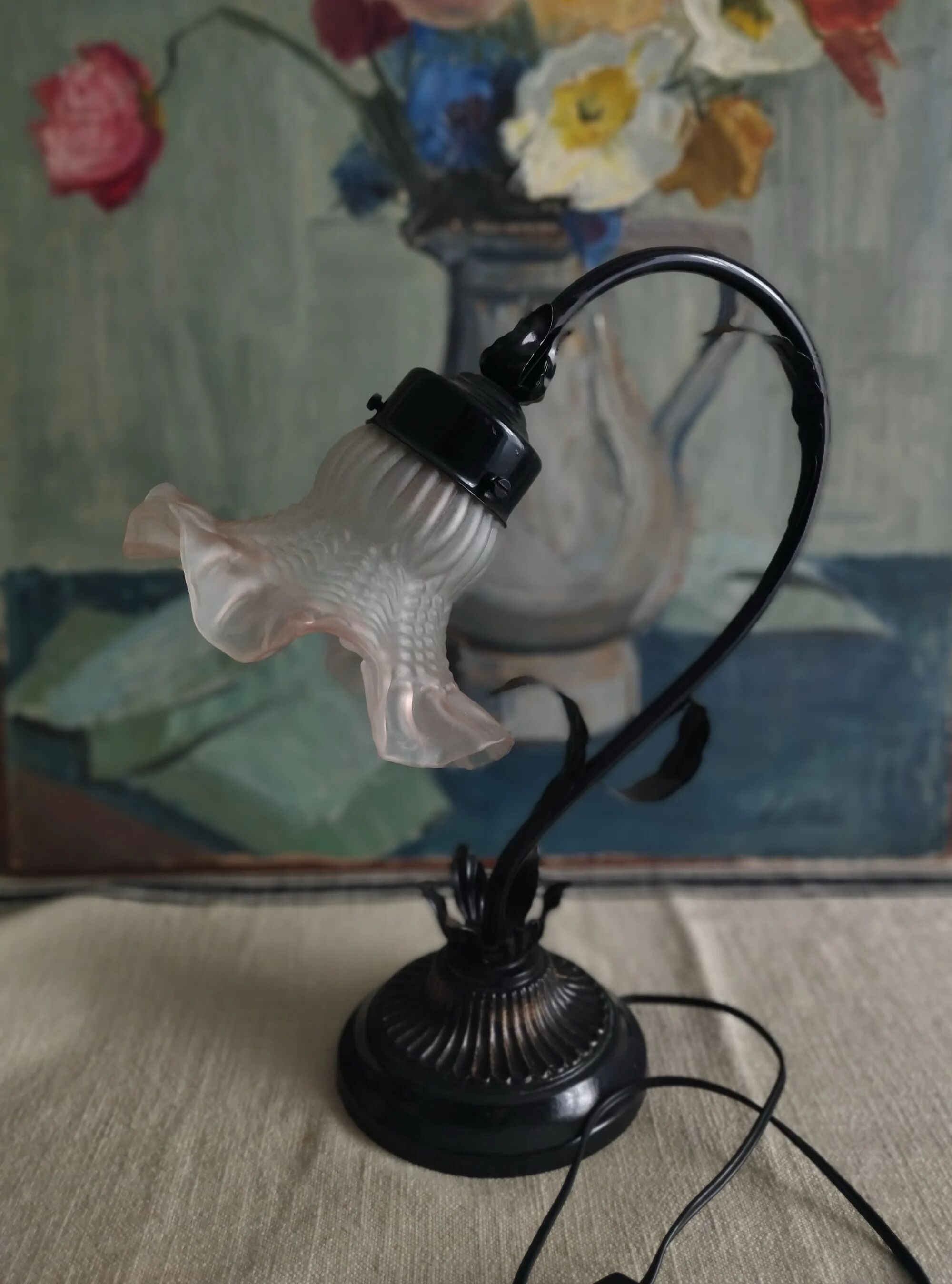Tulip lamp in patinated black metal with an opaque glass shade.