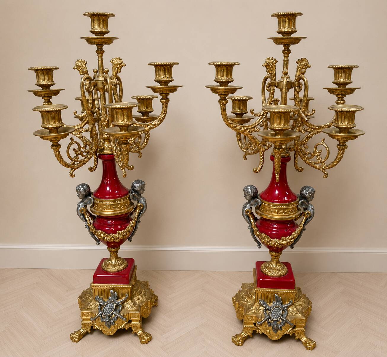 Pair of six-light candelabra in patinated and gilded bronze and spelter.