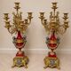 Pair of six-light candelabra in patinated and gilded bronze and spelter.