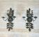 Pair of decorative wall sconces with sunflowers and patinated metal foliage.
