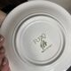 Italian ceramic plates with floral fruit designs.