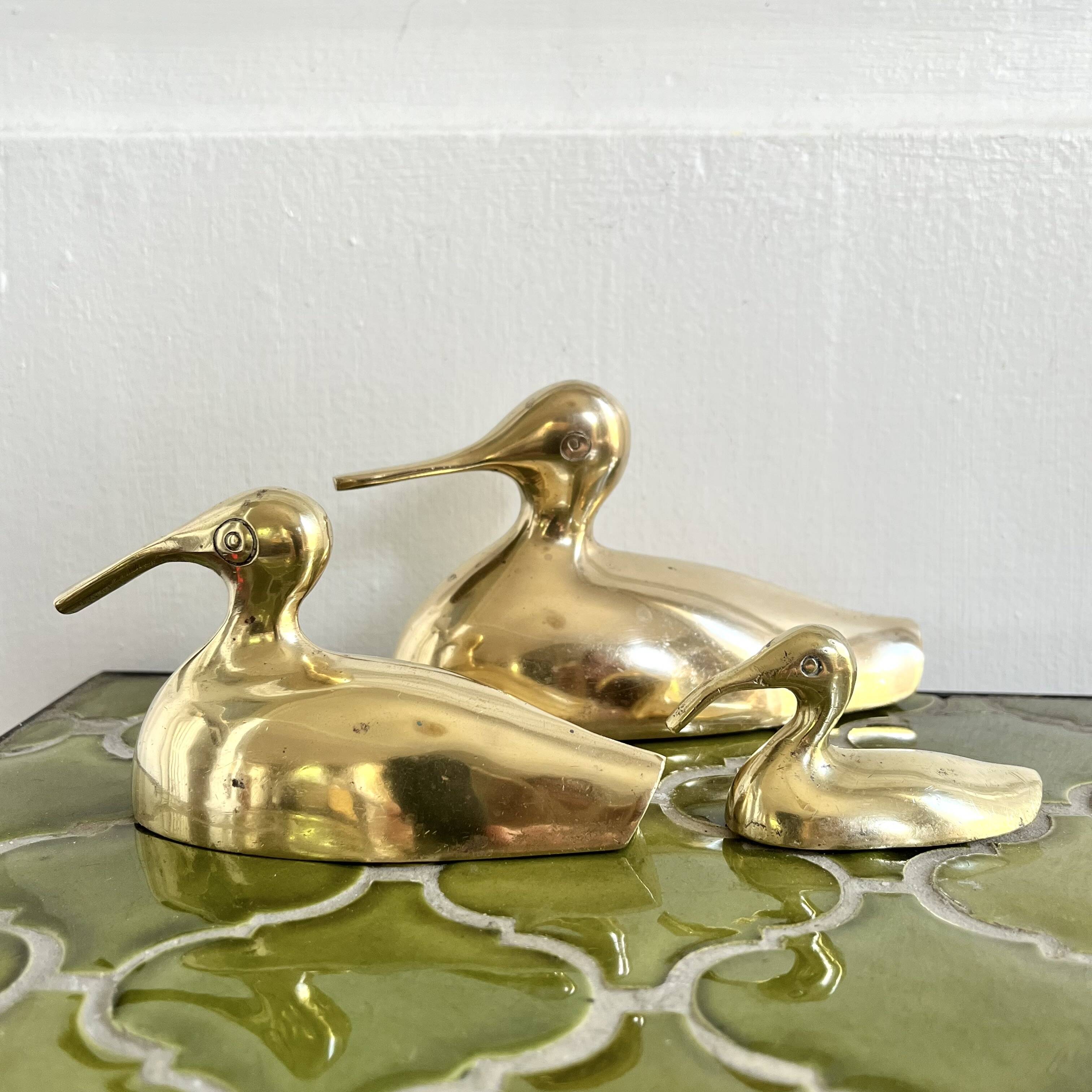 Three brass ducks from the 1950s