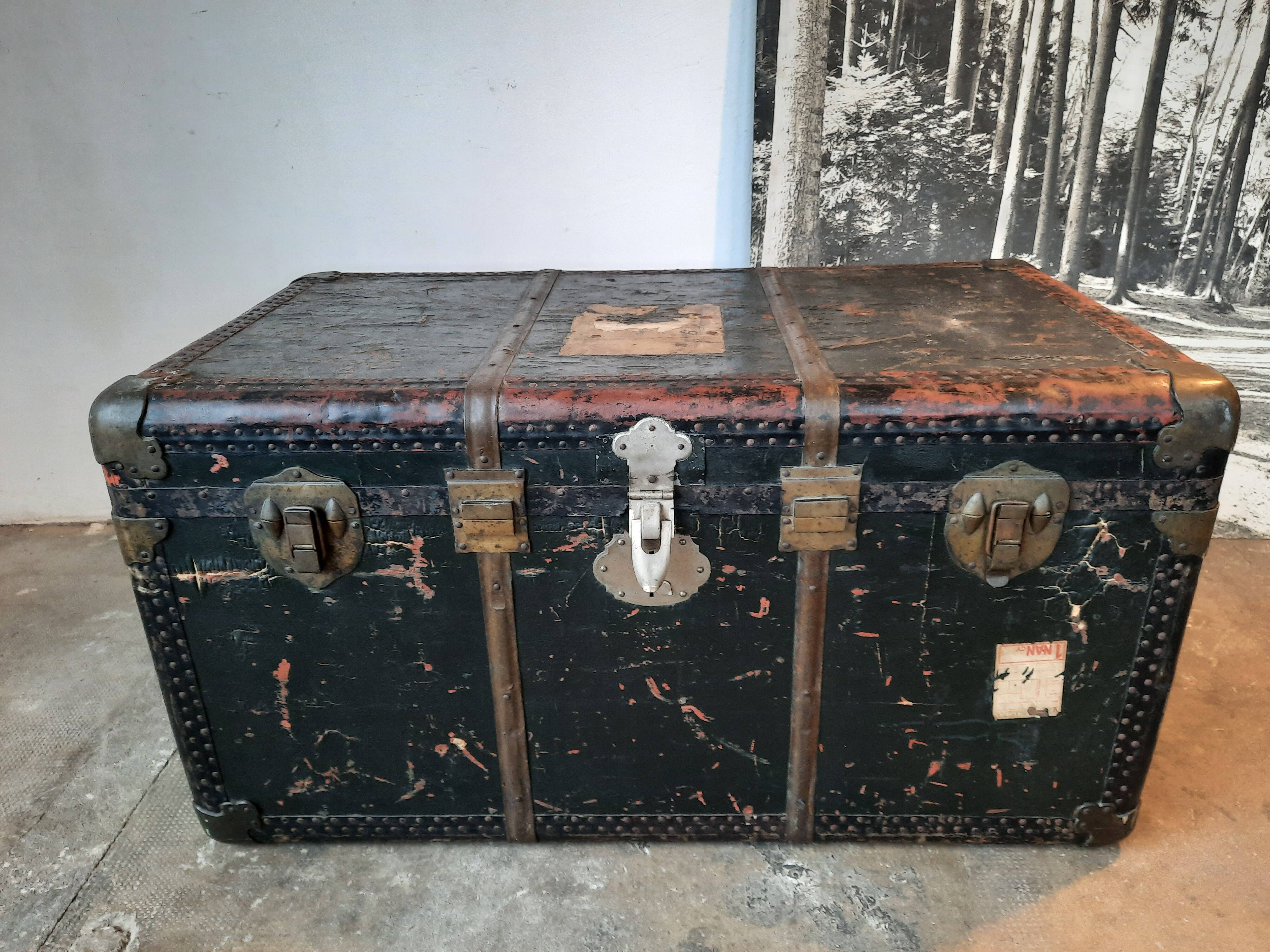 Old and large travel trunk, brass-plated corners