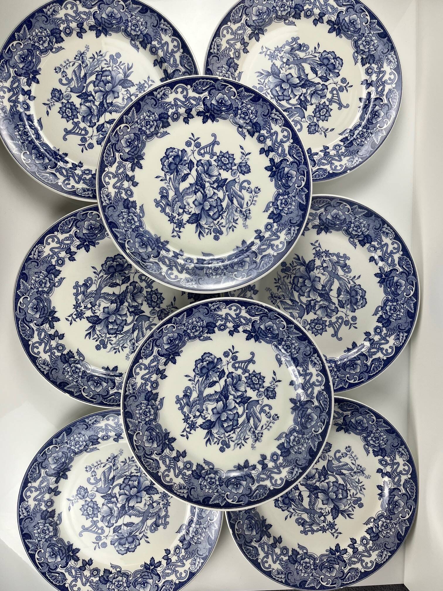 Set of 8 blue earthenware dinner plates with floral and bird decoration, 20th century