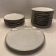 24 plates and a vintage porcelain dish decorated by Lucien Engel.