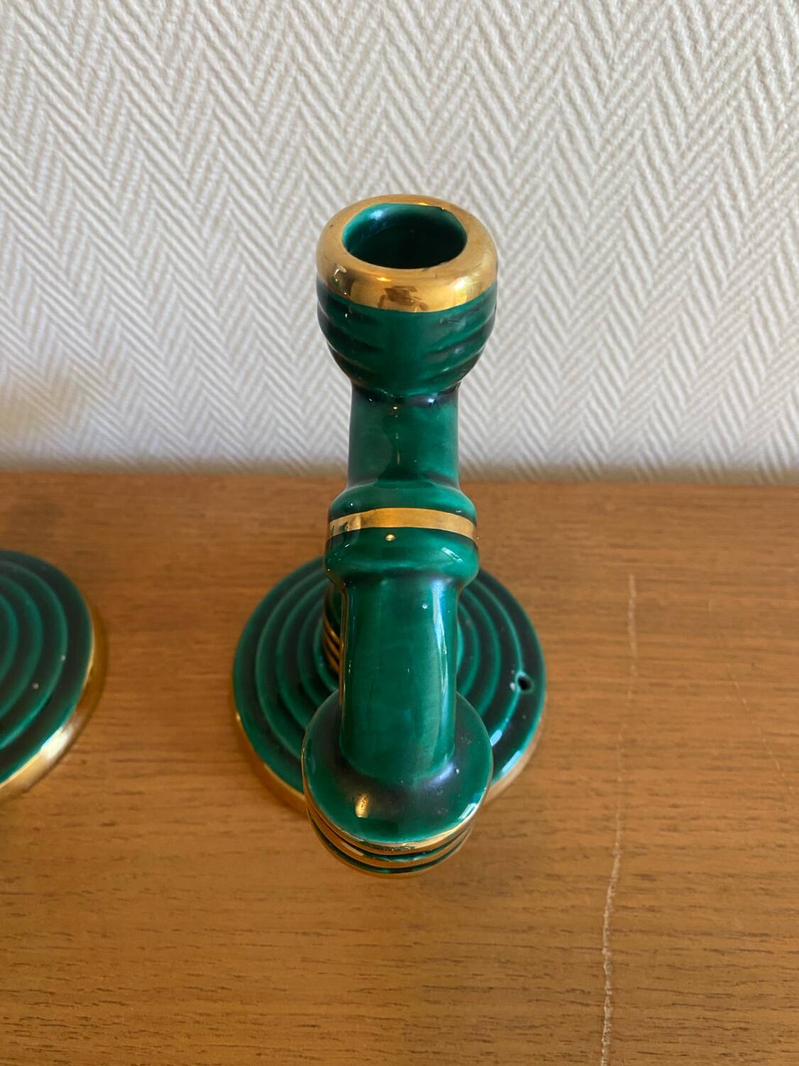 Pair of green and gold ceramic candlesticks