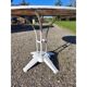 Garden table with a cast iron base and a metal top.