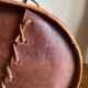 Carved leather pouf in the Mayan style by Angel Pazmino, Ecuador, 1960