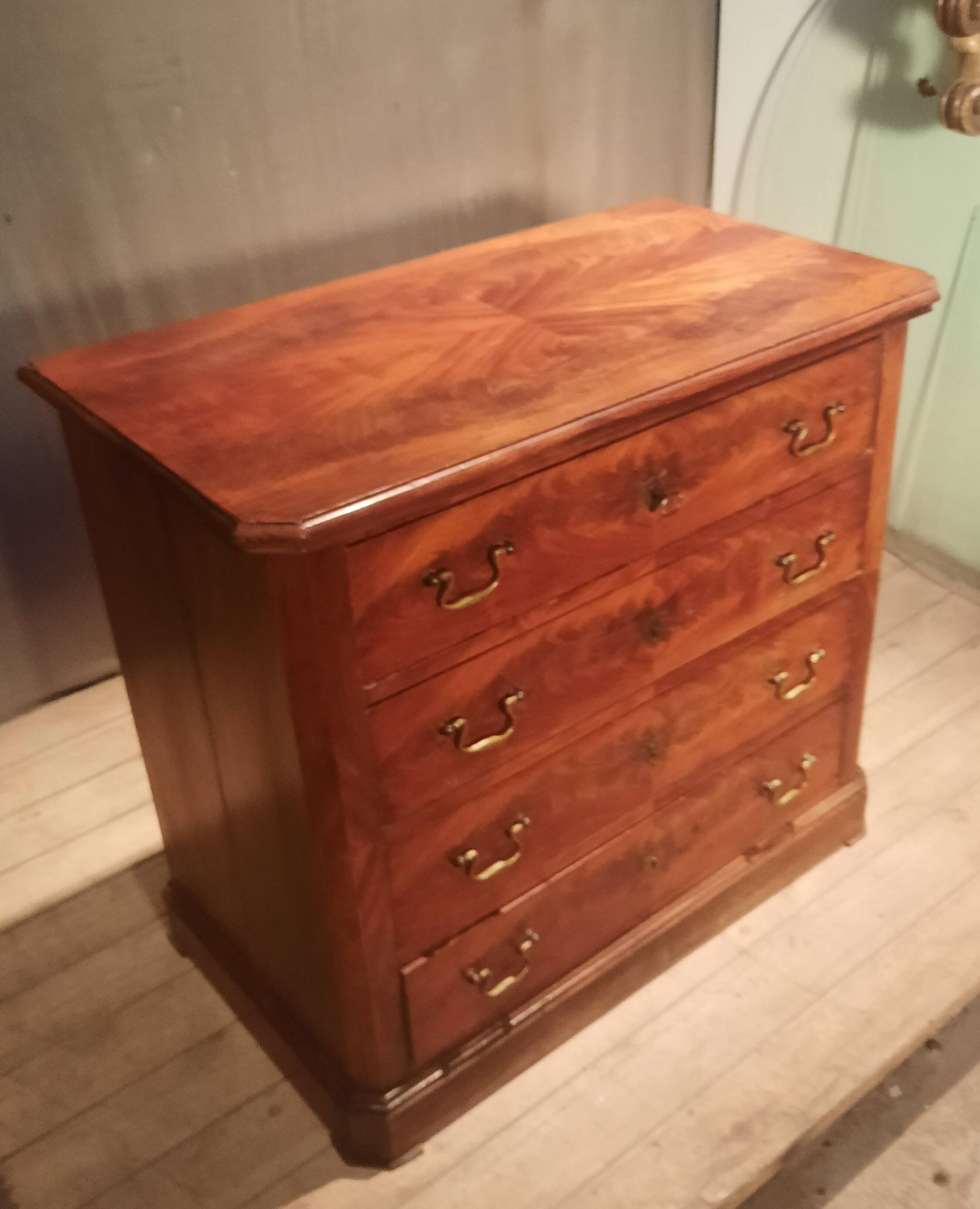 Small Louis Philippe chest of drawers with cut corners.