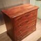 Small Louis Philippe chest of drawers with cut corners.