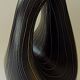 Earthenware vase decorated with yellow lines on a black and yellow background