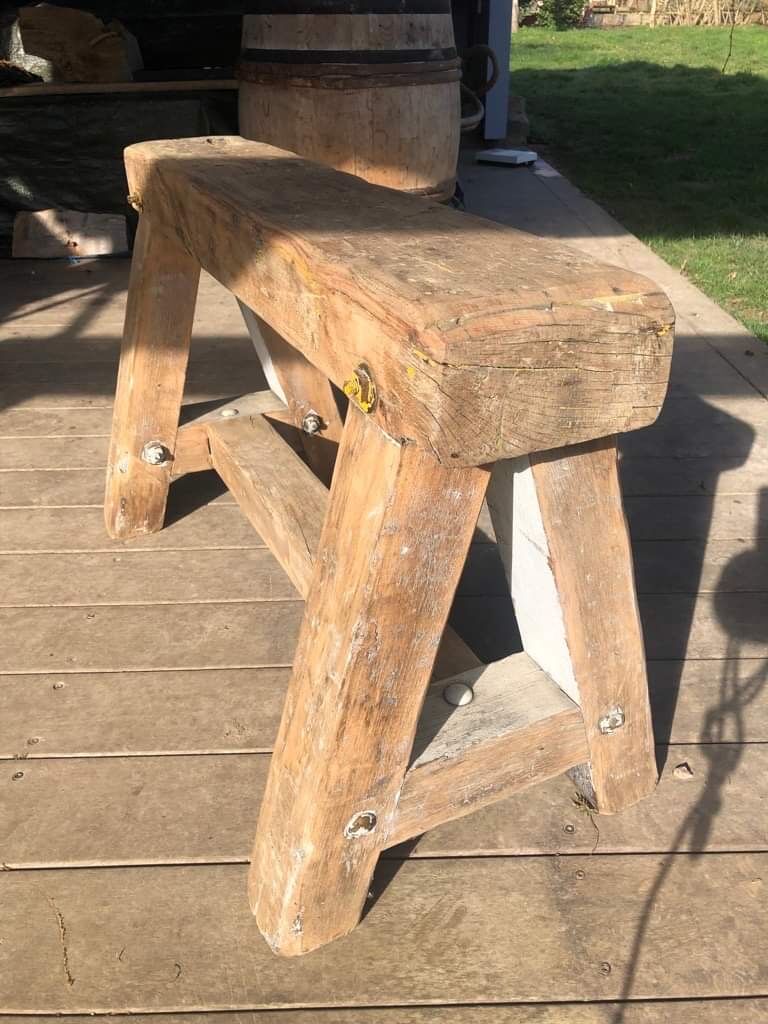 Trestle-shaped wooden bench