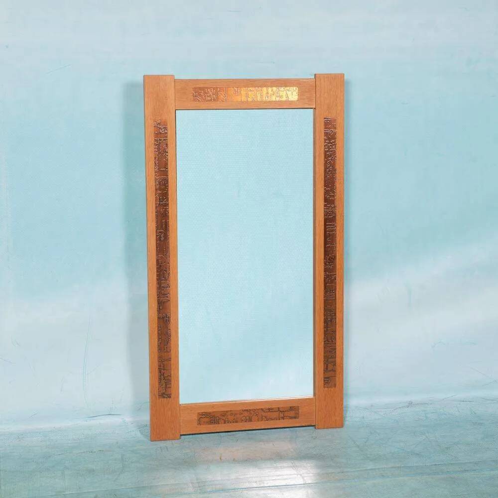 Vintage Danish wall mirror design from the 1960s in oak and stamped brass.