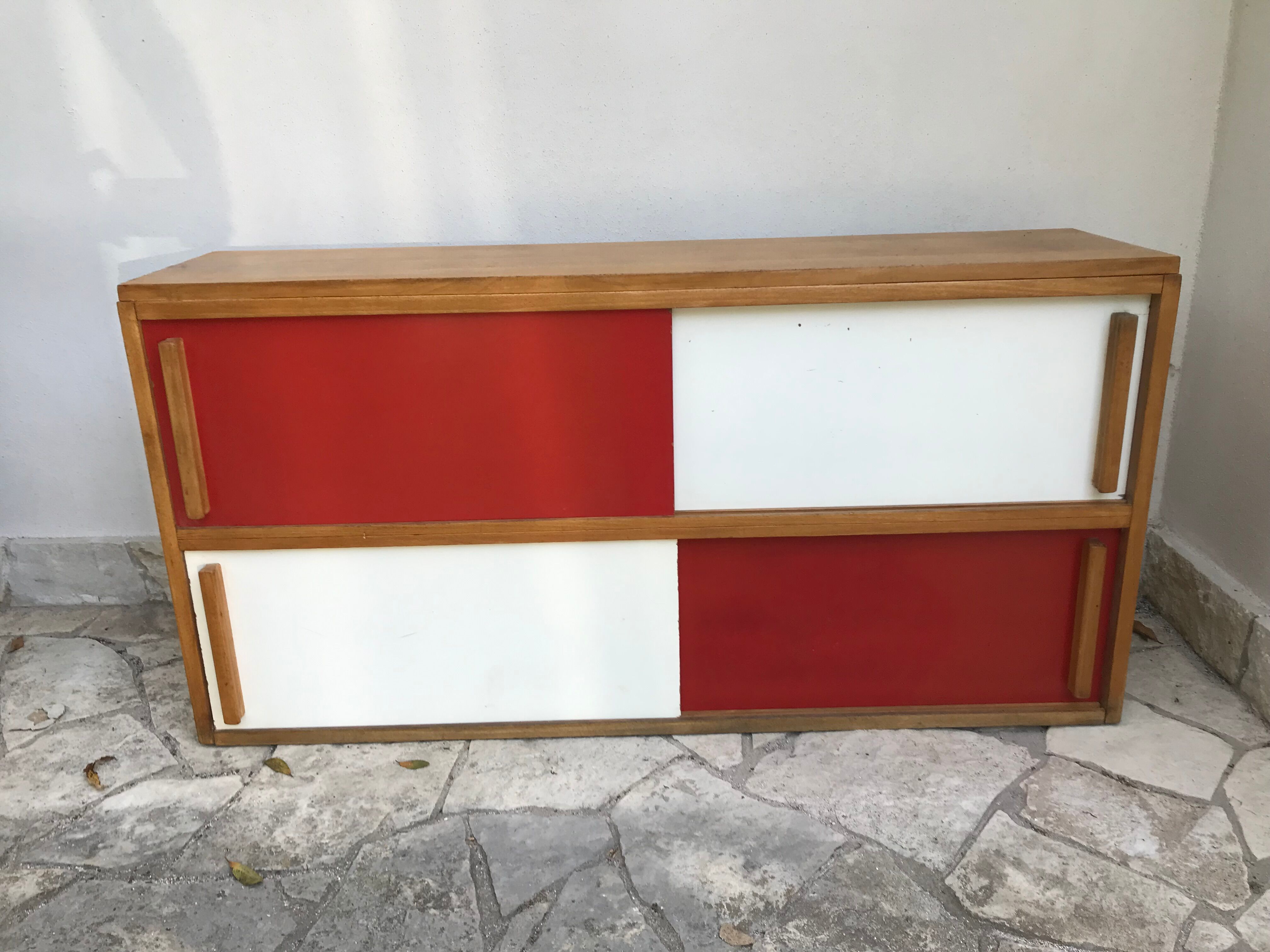 Storage cabinet with sliding doors circa 1950