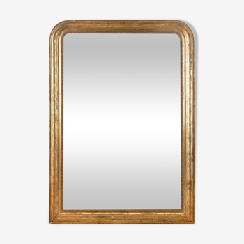 Mirror with golden patina