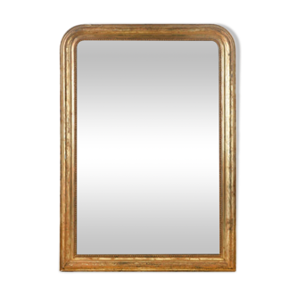 Mirror with golden patina