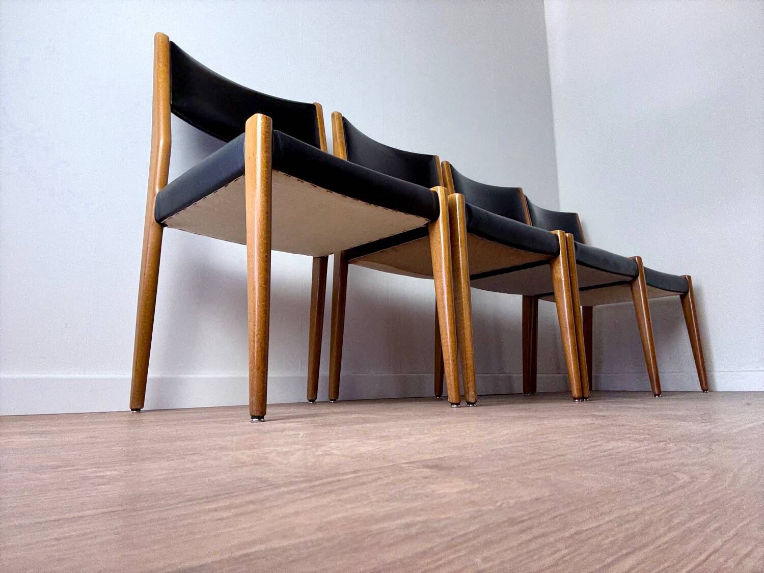 Set of 4 wooden and black leatherette chairs