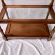 Classic wooden shelves, glass tops and cannage