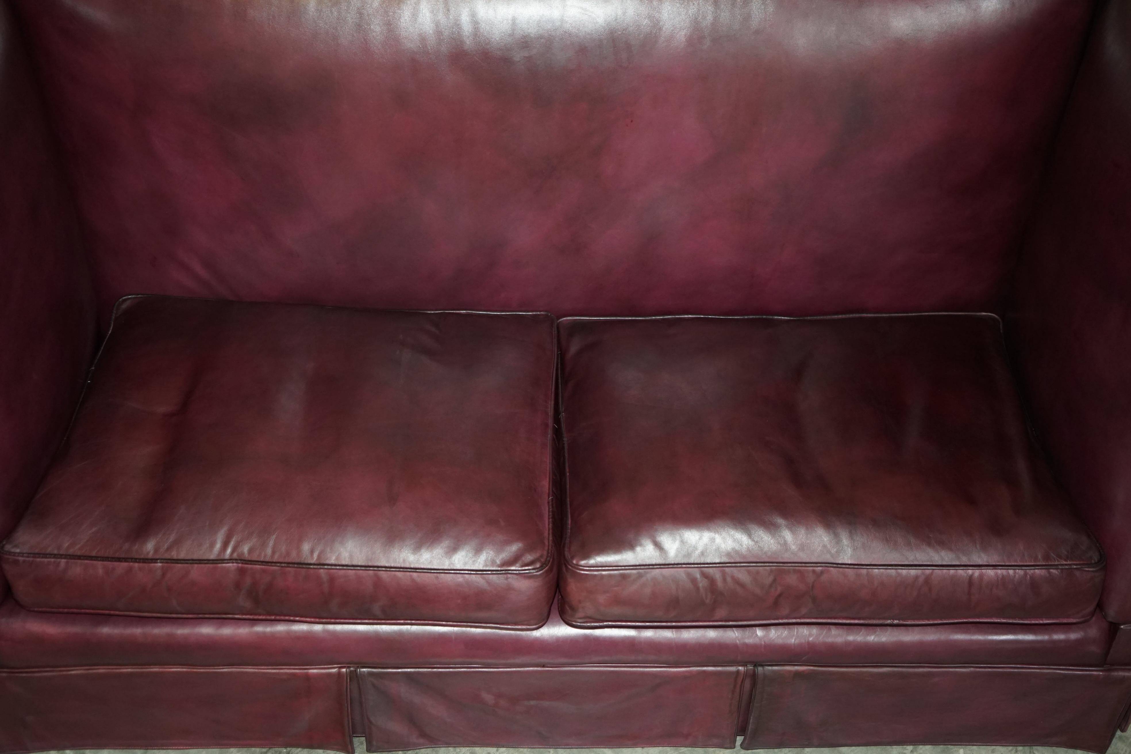Victorian Knole canapé restored in leather with feather cushions.