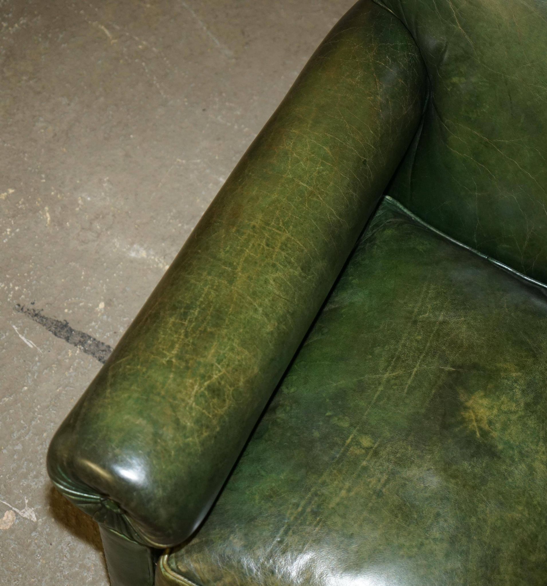 Victorian leather canapé, shield armrests, stamped Maple & Co.