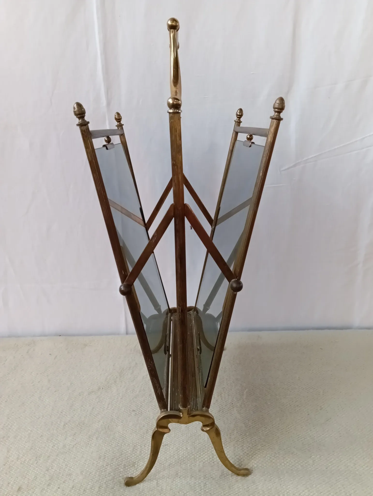 Neo-classical brass magazine rack in the spirit of Maison Jansen.