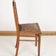 Chaise style Art Déco en bois sculpté et cuir.