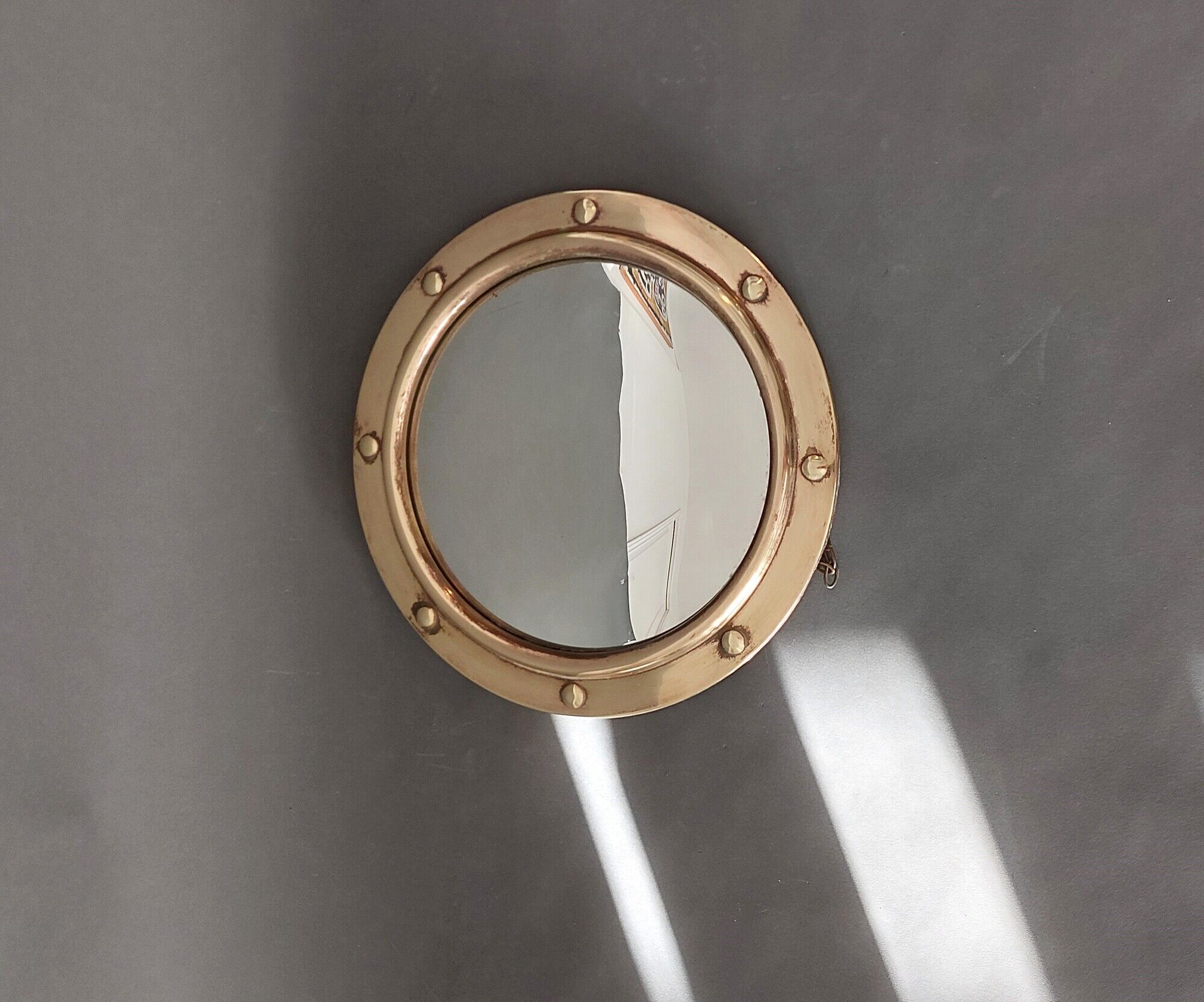 Witch porthole mirror 1940 in vintage gilded brass.