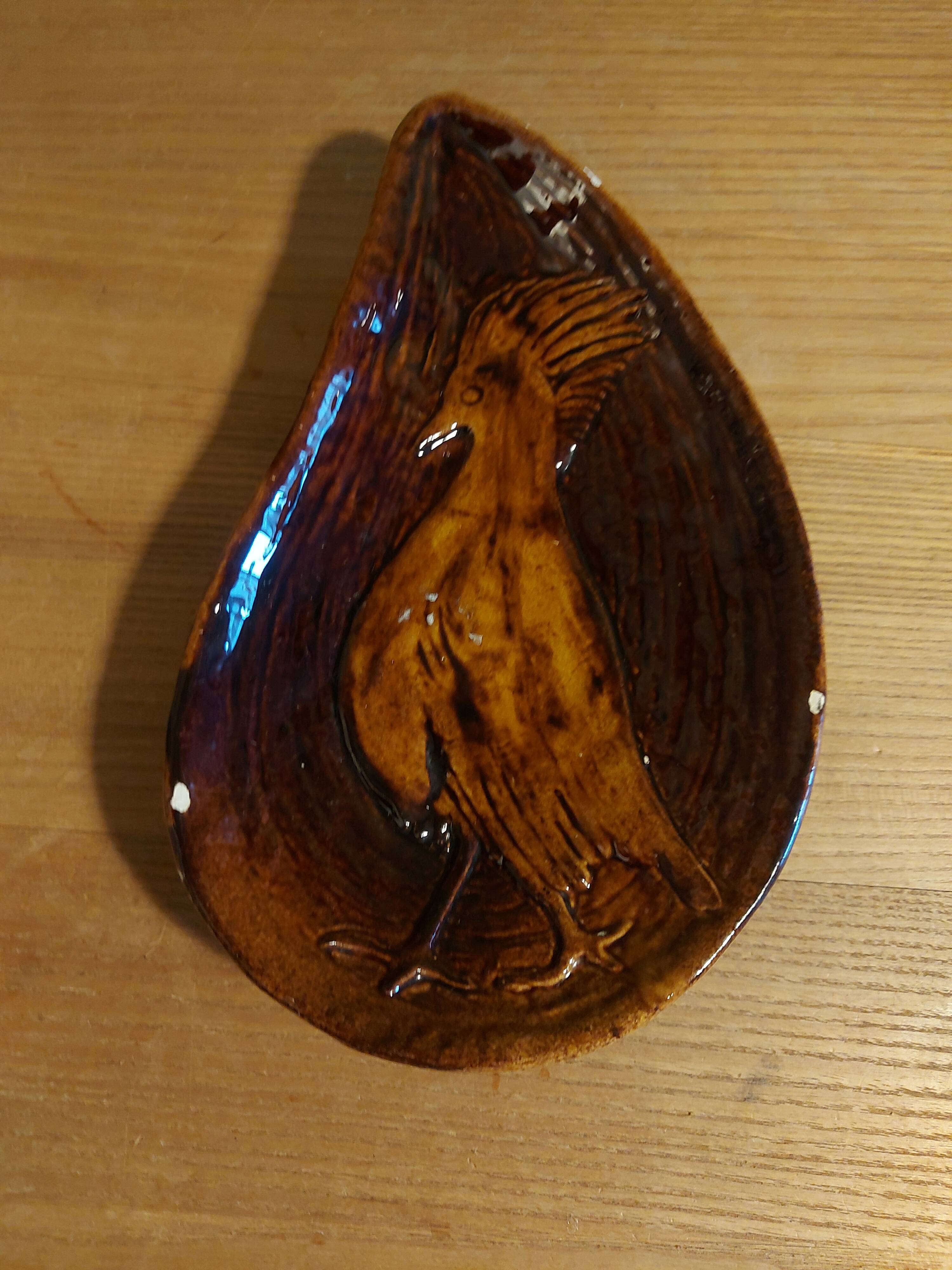 Empty pocket with vallauris bird decoration