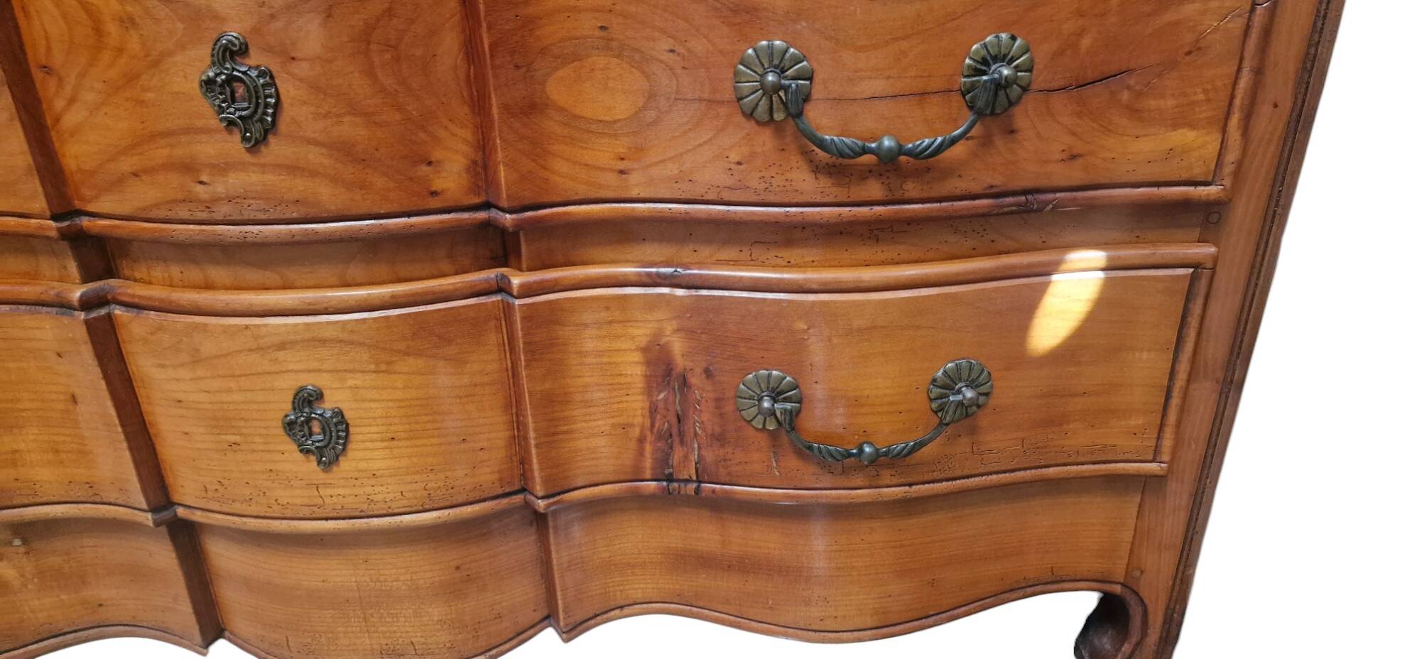 Crossbow chest of drawers with caramel patina
