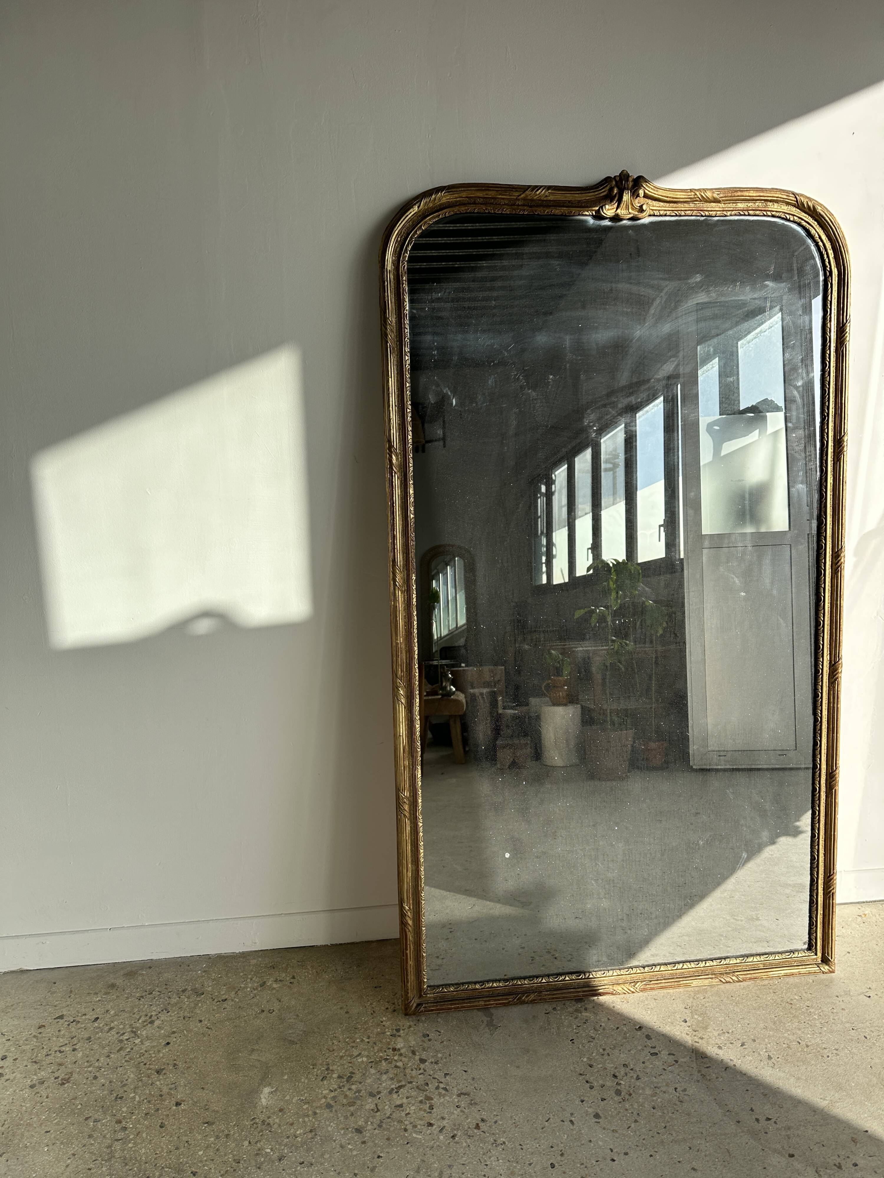 Large gilded mirror 19th century rounded corners mercury glass Louis XVI style