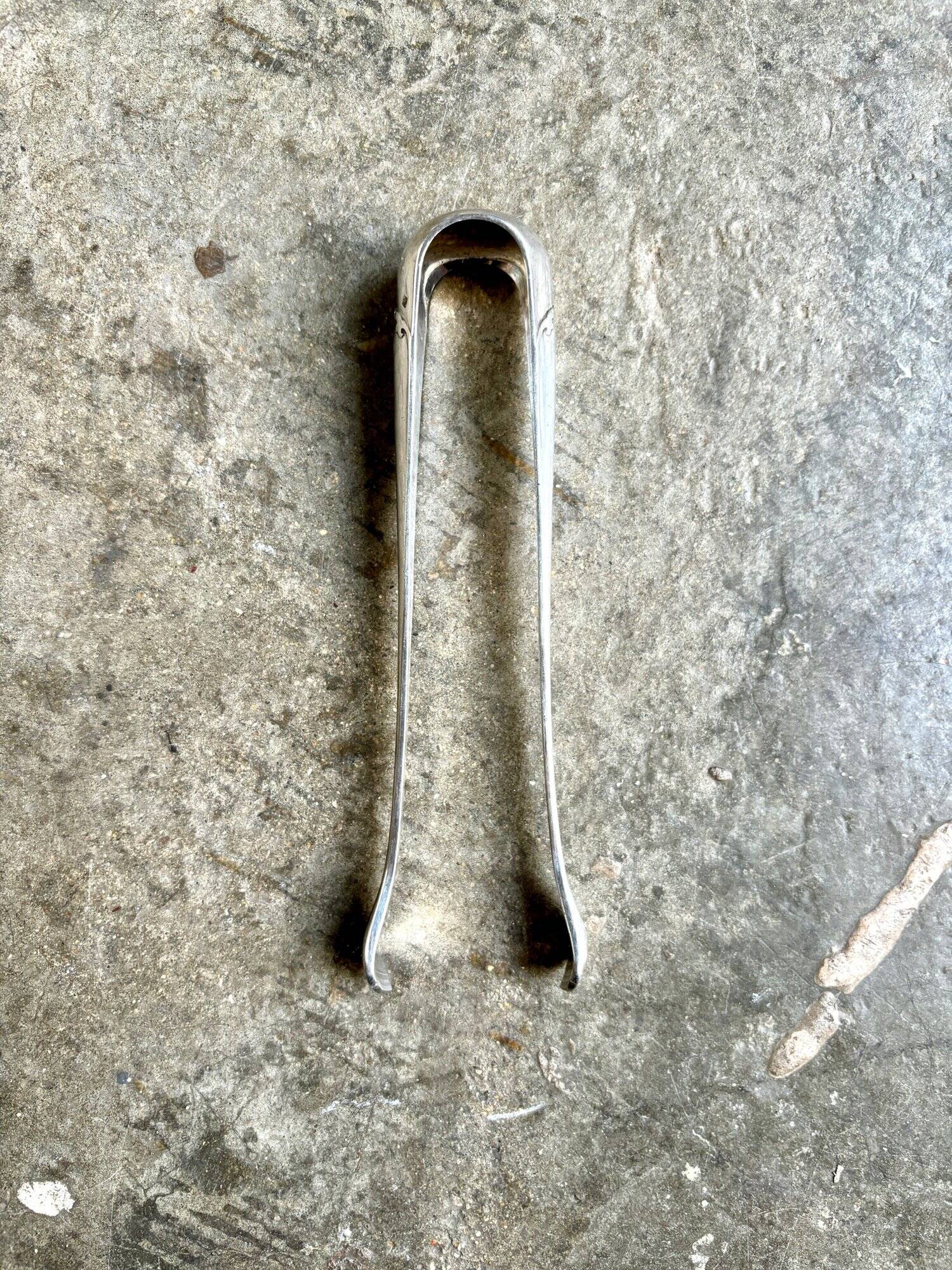 Christofle sugar tongs in silver metal
