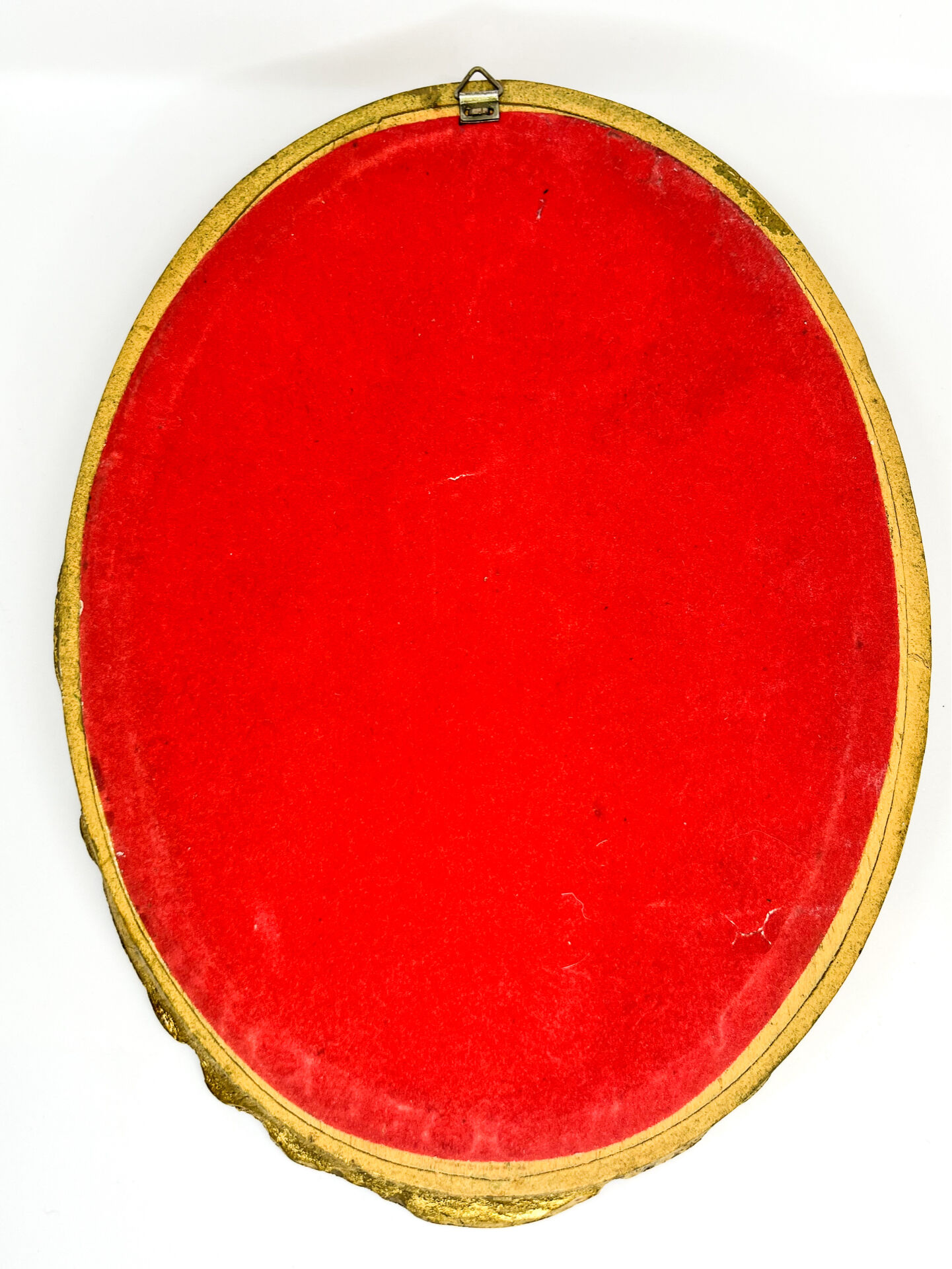 Antique oval mirror in gilded wood