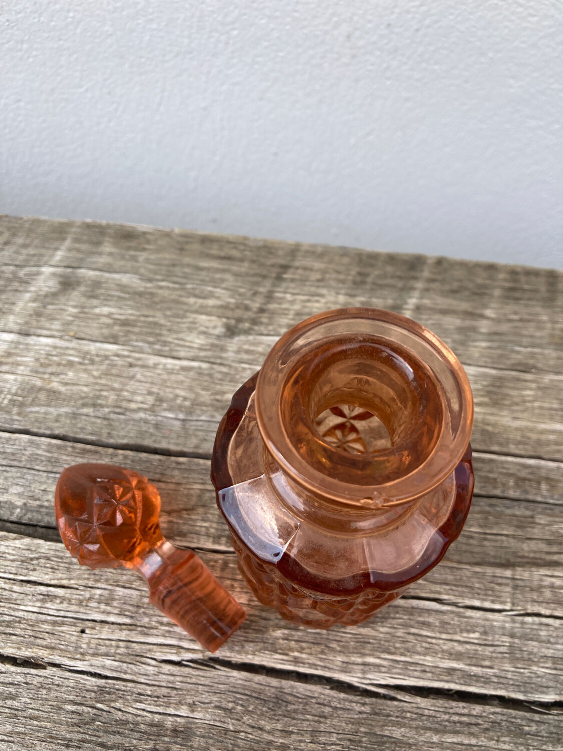 Art Deco perfume bottle in old amber pink glass